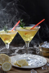 Cocktail in a glass with fruit on an old background.
