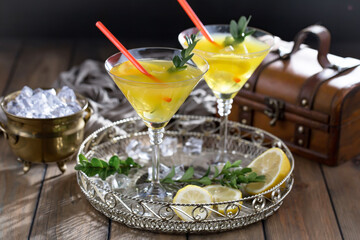 Refreshing summer alcoholic cocktail with crushed ice and citrus fruits