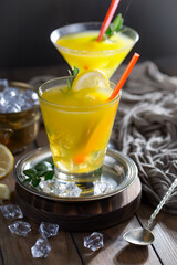 Refreshing summer alcoholic cocktail with crushed ice and citrus fruits