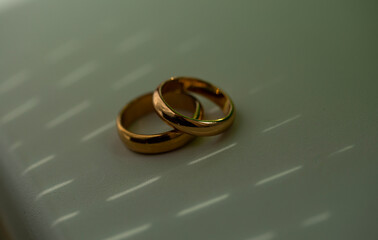 wedding rings on a table. shadow. Ring