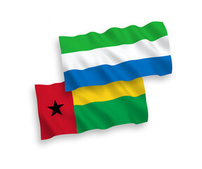 Obraz premium Flags of Republic of Guinea Bissau and Sierra Leone on a white background