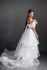 Fototapeta na wymiar Beautiful bride. Wedding hairstyle and make up. Fashion wedding dress