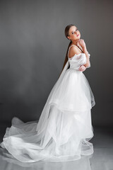 Fototapeta na wymiar Beautiful bride. Wedding hairstyle and make up. Fashion wedding dress