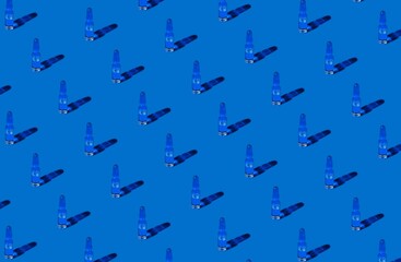 Background for the design and banner. An ampoule with a solution for injection on a blue background. Pattern