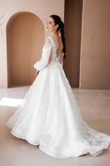 Smiling young woman posing in a wedding dress