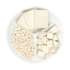 Processed white tofu, on a small white serving platter. Three slices, cubes and crumbled tofu. Bean...