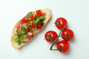 Delicious italian snack bruschetta and tomatoes on white background