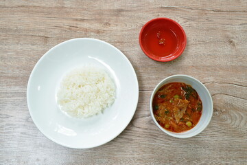 beef meat curry with eggplant in coconut milk or Panang Thai food on bowl with rice