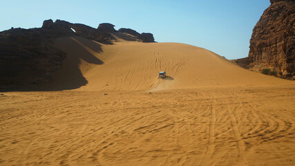 Fototapeta na wymiar desert, mountains, camels, sun, Saudi Arabia