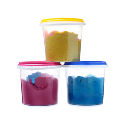 Kinetic sand and toys in buckets on white background