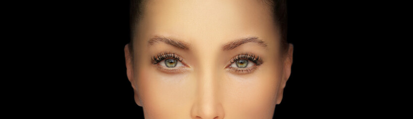 Woman green eyes with makeup and long eyelashes