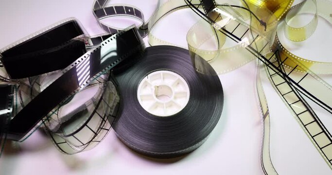 Circular Counterclockwise Pan on a film reel with some ruffled film clips