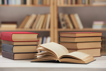 Many books on white table in library