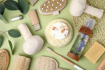 Eco friendly personal care products on light green background, flat lay