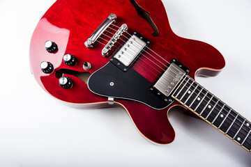 A red electric guitar for the discerning musician - obrazy, fototapety, plakaty