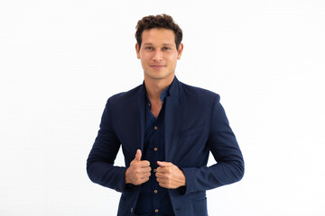 Smiling young hispanic businessman standing isolated on white background