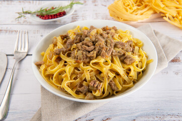 lamb and artichokes is a dish of hand-made fettuccine typical of the cuisine of Lazio and the area of Rome city