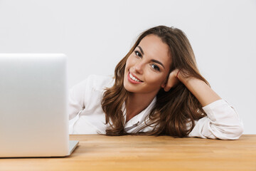 Attractive young businesswoman working isolated