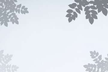 Obraz premium Abstract leaves shadow black and white leaf shadow on a white wall Background. Blank copy space.