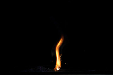 fire flame with reflection in the glass on a black background
