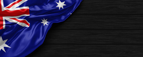 Close Up of Australia flag on the black wooden background 3D render