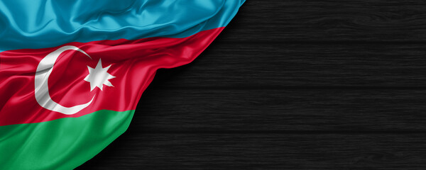 Close Up of Azerbaijan flag on the black wooden background 3D render - obrazy, fototapety, plakaty