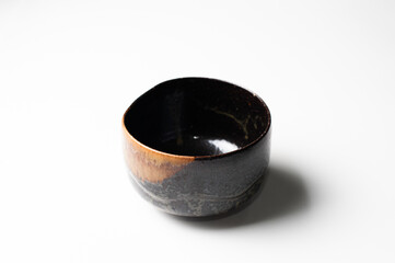 Crafted vintage black and brown bowl isolated on white