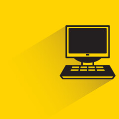 desktop computer with shadow on yellow background