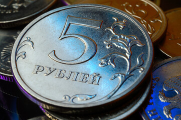 Russian coin with a denomination of 5 rubles is highlighted in blue. close-up.