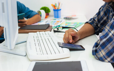 Mobile app designers are testing mobile applications on device. © Wasan