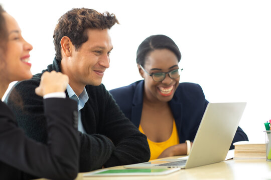 Business man manager leader in meeting with two woman analyzing ducuments on laptop computer in home office.