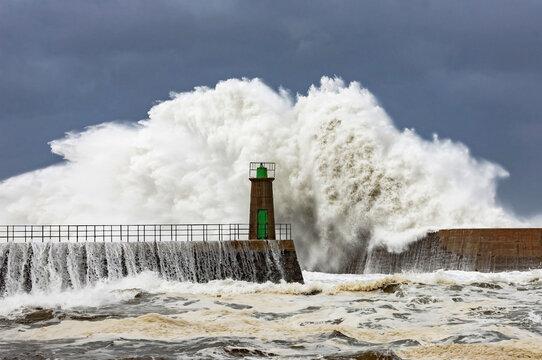 Powerful stormy sea and lighthouse