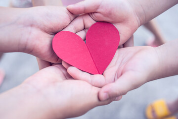 Children's hands holding love and charity concept illustration