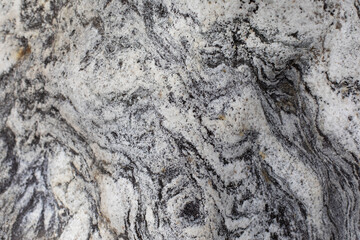The texture of the stone. The surface of the rock is in detail. Beautiful background natural rock.