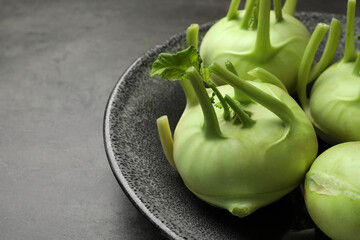 Whole ripe kohlrabi plants on grey table, closeup