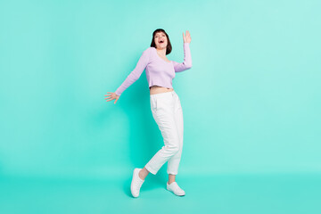 Fototapeta na wymiar Full length body size photo woman in casual outfit dancing at party laughing overjoyed isolated vivid teal color background