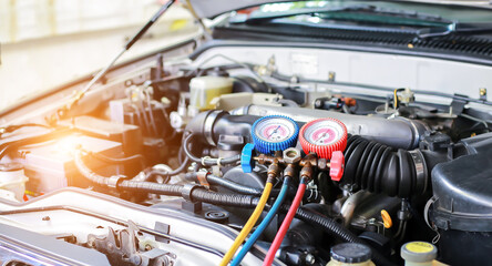Car maintenance and service Auto mechanic Use a manifold gauge. Check refrigerant and refill car...