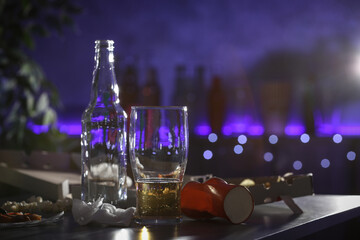 Messy table with beer and food leftovers indoors, space for text. After party chaos
