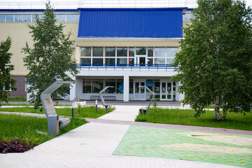 Fototapeta na wymiar Original benches in the Geologists ' Square in the city of Noyabrsk in summer