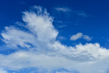 Beautiful white clouds on blue sky background.