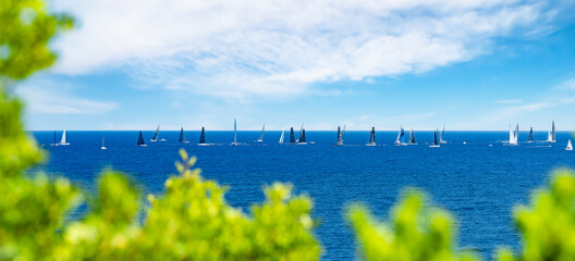 Selective focus, stunning view of a sailboat sailing during a Maxi Yacht competition in Porto...
