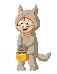The cute boy with the wolf costume is holding the basket of candies