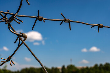 barbed wire against sky