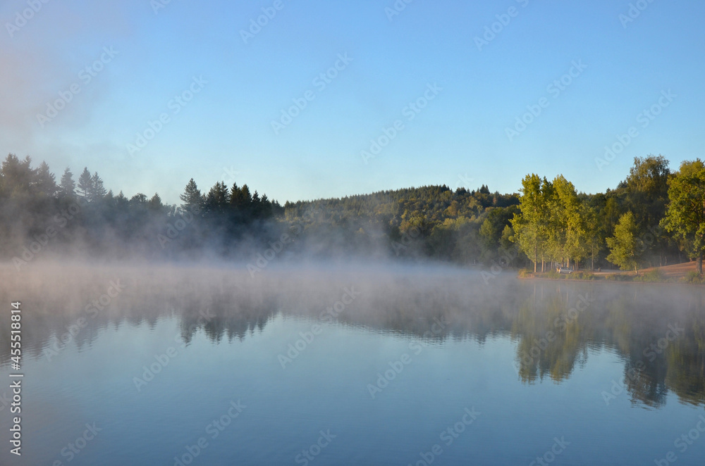 Canvas Prints rising fog at the lake. lac de ponty, ussel, france.