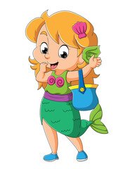 The little girl with the mermaid costume is holding the basket