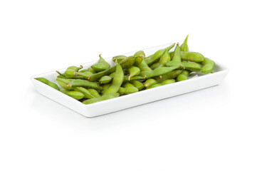 Plate of edamame on white background. Asian food