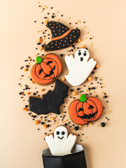 Various Halloween gingerbread cookies - Jack O'Lanterns, black hat, ghosts, bat and sugar sprinkles...