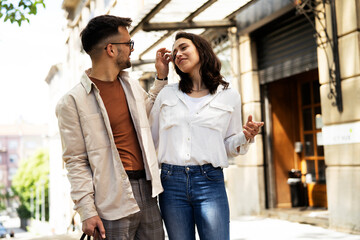 Happy young couple outdoors. Loving couple having fun together.