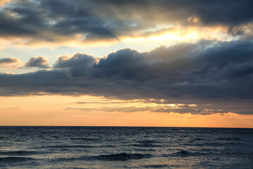 Picturesque view of beautiful sky with clouds over sea at sunset