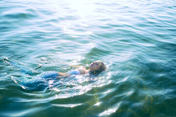 Blonde in a mermaid costume